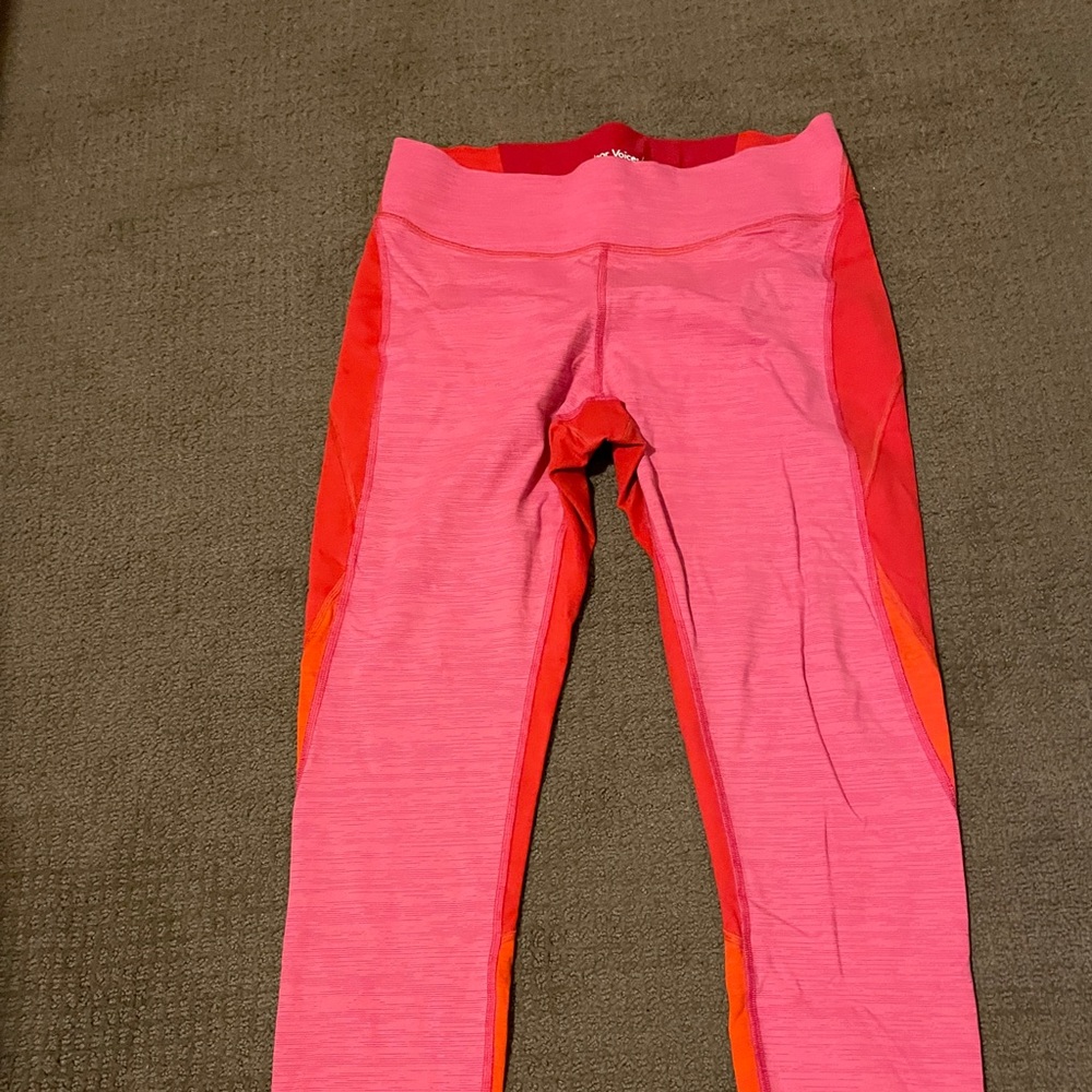 Hot pink, orange, and red Outdoor Voices leggings